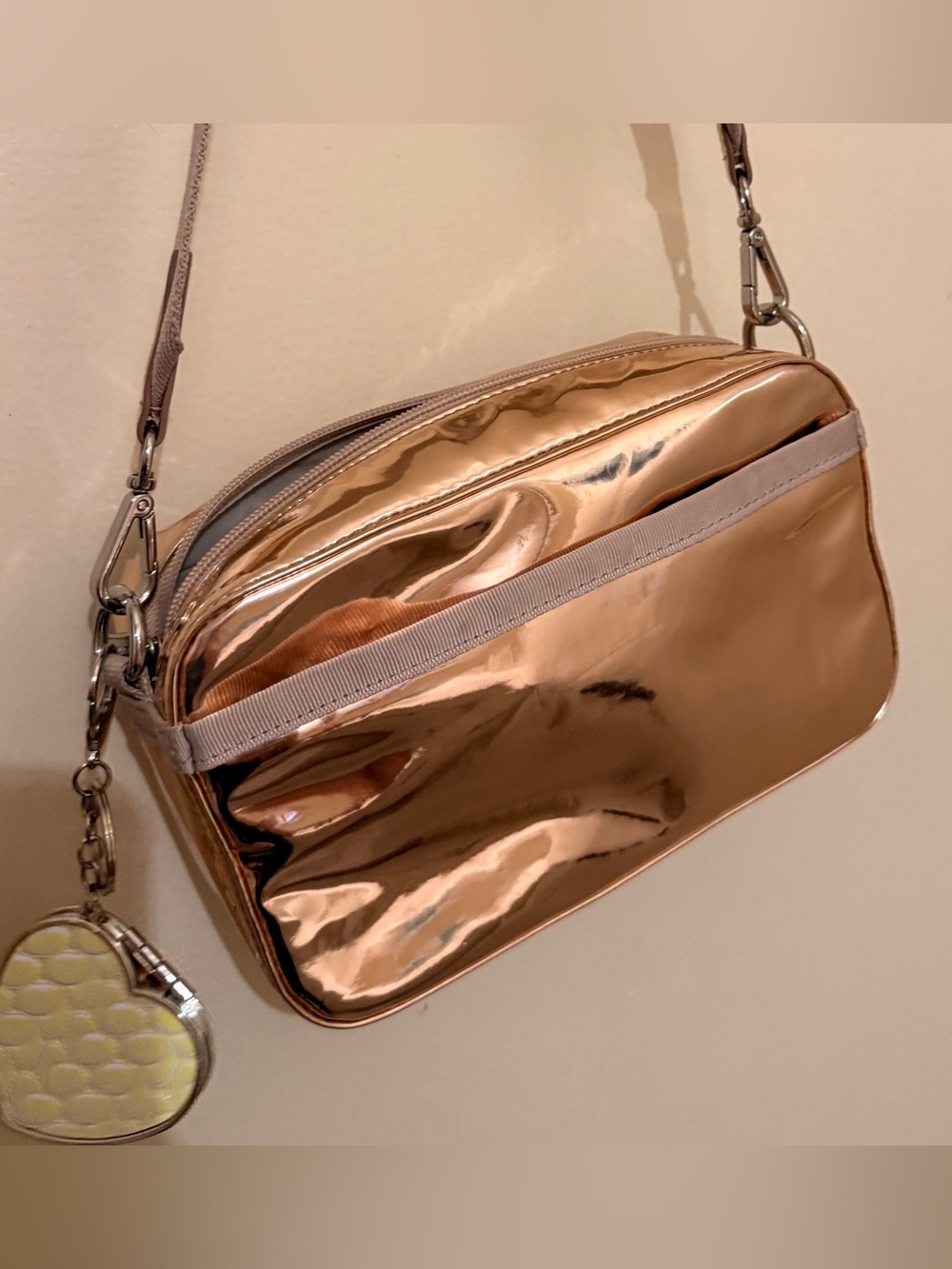 LE Sport Sac Metallic Rose Gold Crossbody Bag with Heart Charm